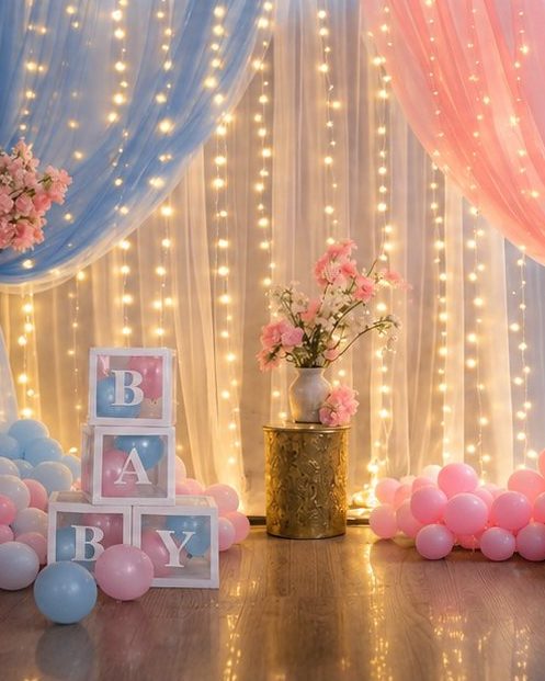 Gender reveal setup with blue and pink balloons