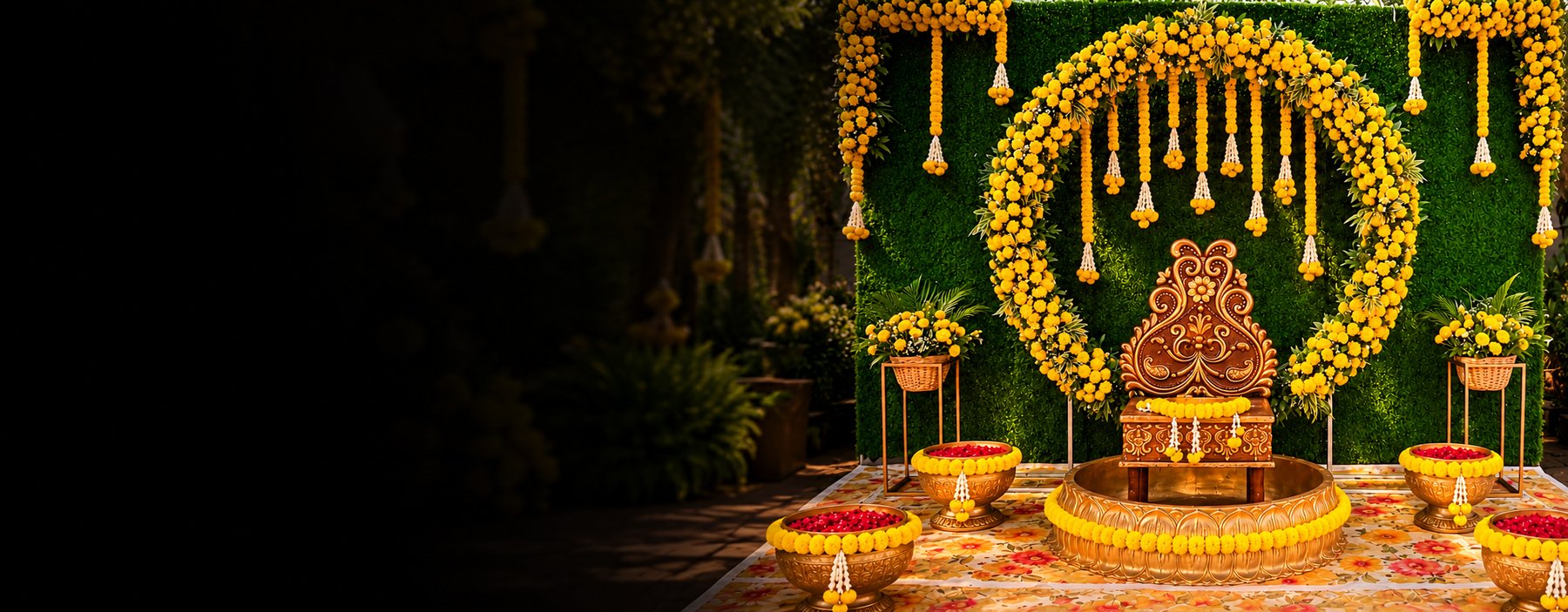 Marigold flower arch haldi decor with green wall backdrop and brass urns of rose petals