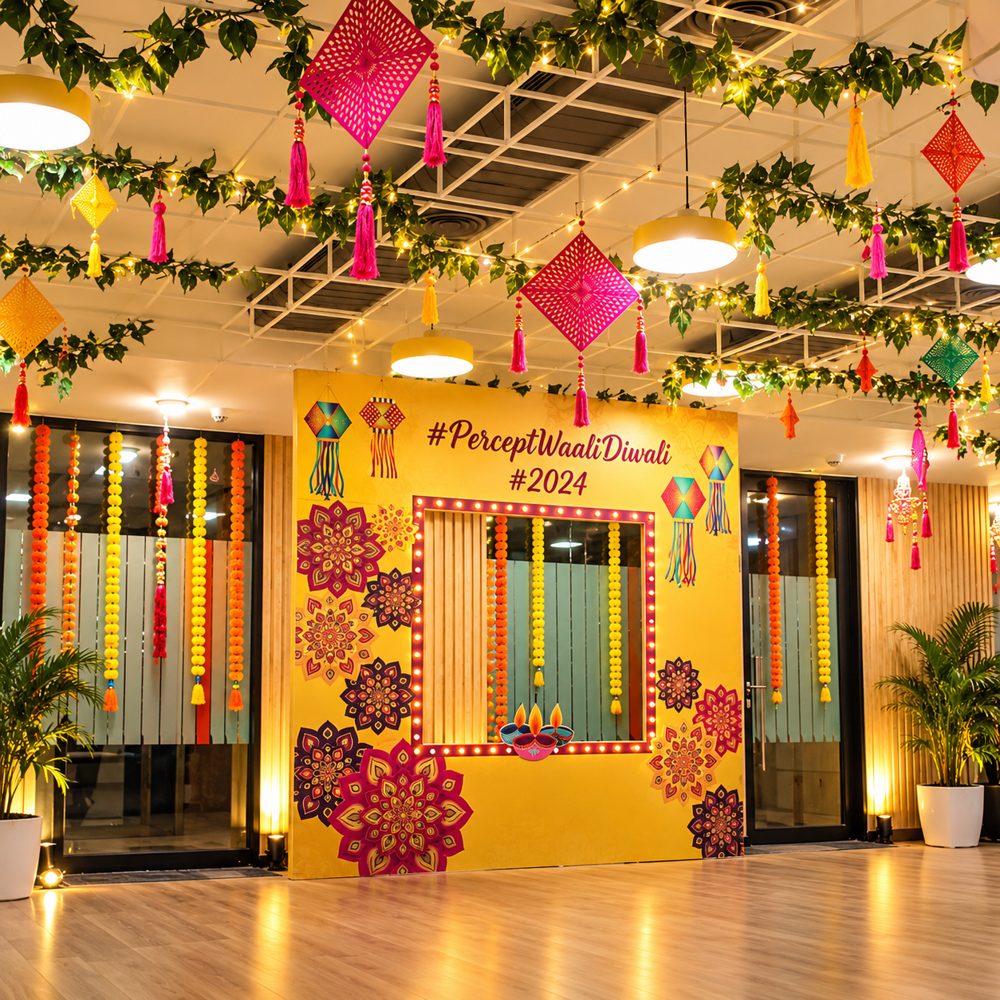 Diwali decor: office Diwali photo wall with hanging kites, marigold strings and fairy lights